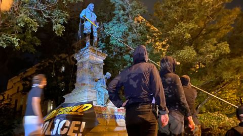 Demonstrators attempt to topple the Albert Pike statue in Washington, on Friday, June 19.
