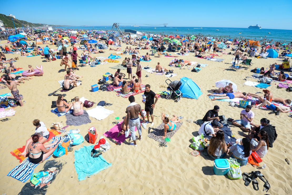 Visitors enjoy the hot weather on the beach on Thursday in Bournemouth.