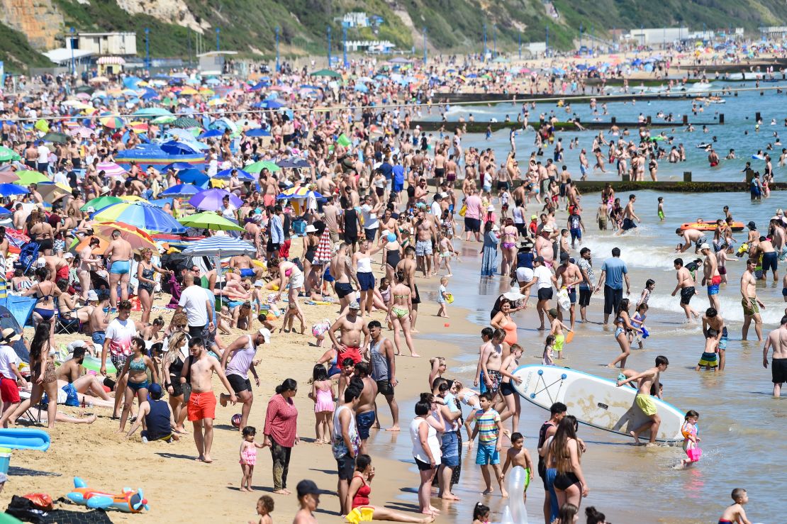 Crowds cool off at Bournemouth beach during a heatwave in the UK on Thursday.