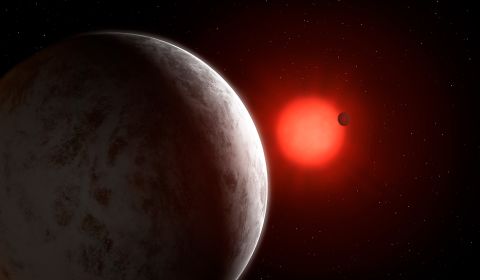 This is an artist's impression of the multiplanetary system of newly discovered super-Earths orbiting a nearby red dwarf star called Gliese 887.