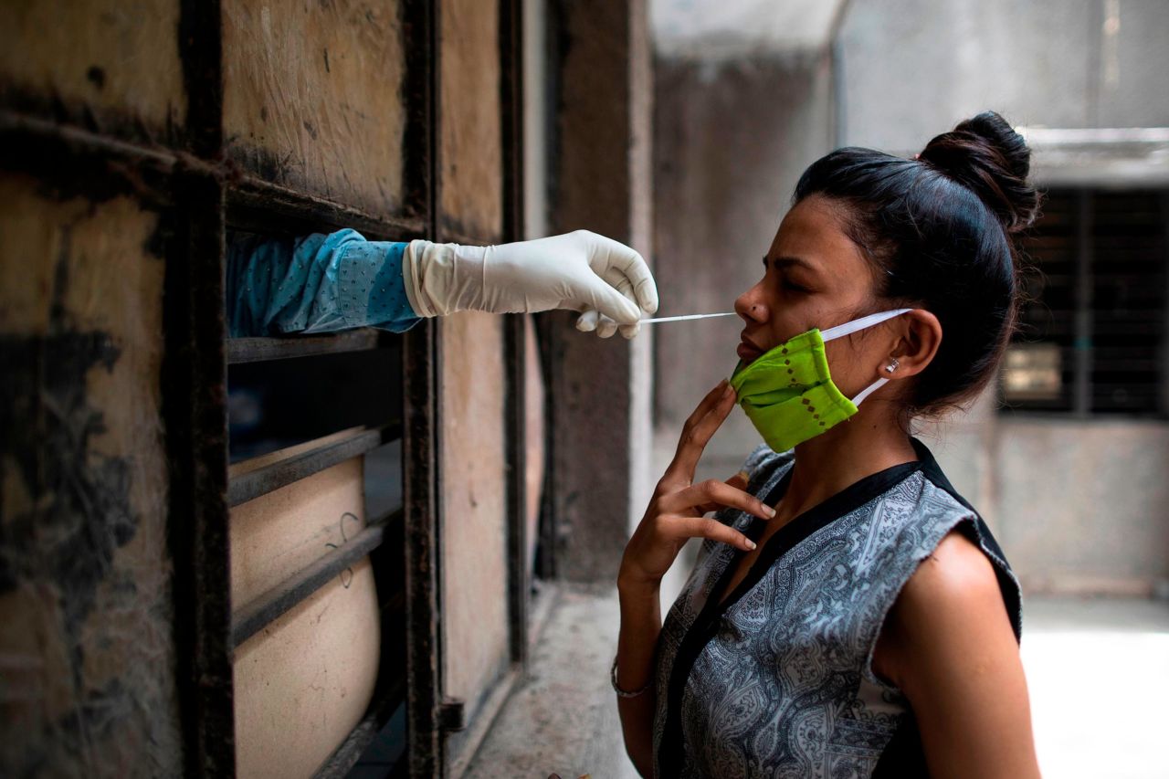 A woman is tested for the novel coronavirus at a facility in New Delhi on Friday, June 19. <a href="https://www.cnn.com/2020/06/25/india/delhi-hospital-crisis-coronavirus-hnk-intl/index.html" target="_blank">New Delhi recently surpassed Mumbai</a> as India's worst-hit city.