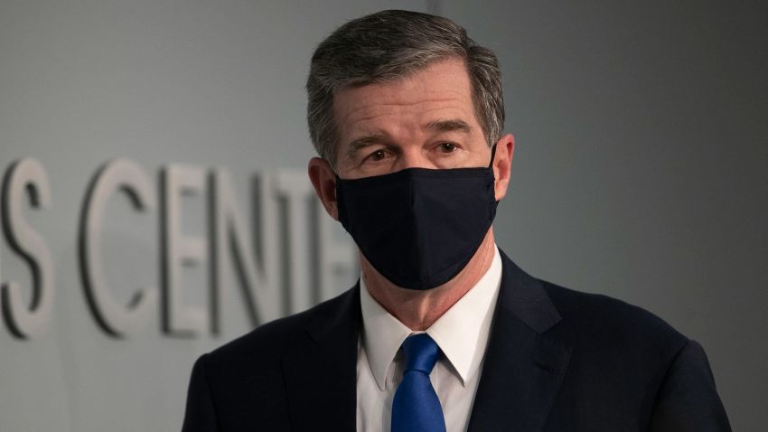 North Carolina Gov. Roy Cooper arrives for a press briefing on the COVID-19 virus at the Emergency Operations Center on Wednesday, June 24, 2020 in Raleigh, N.C. (Robert Willett/The News & Observer via AP)