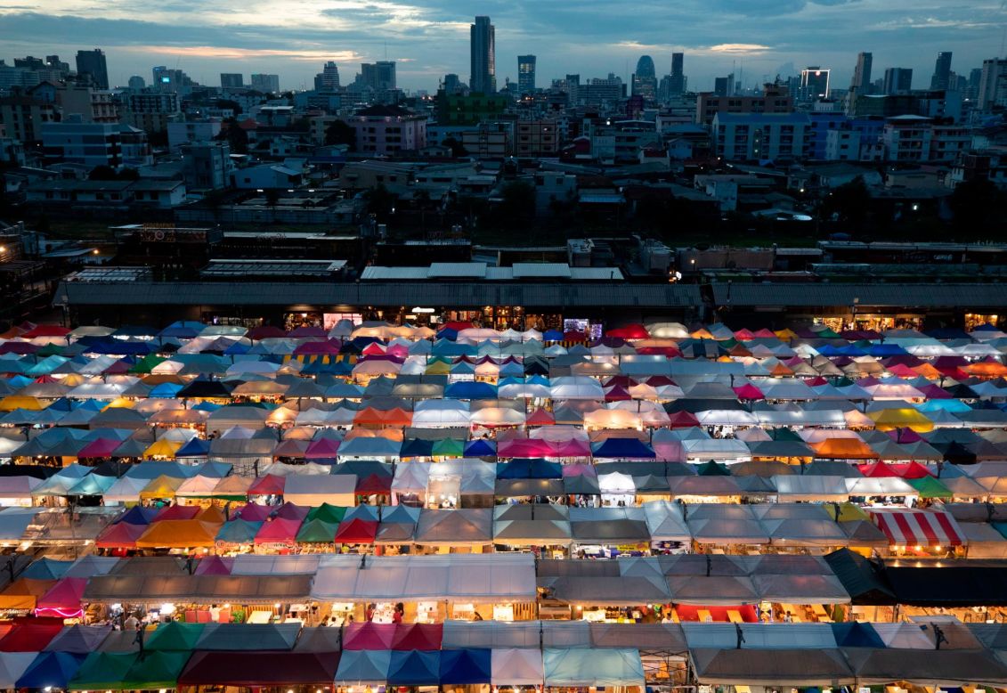 Vendor tents are illuminated at the Rot Fai Market in Bangkok, Thailand, on Friday, June 19.