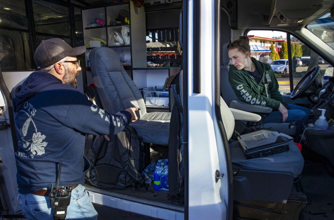 Cahoots crisis councilor Ned White, left, and EMT Rose Fenwick wrap up a day shift with a stop in  Eugene in December 2018.