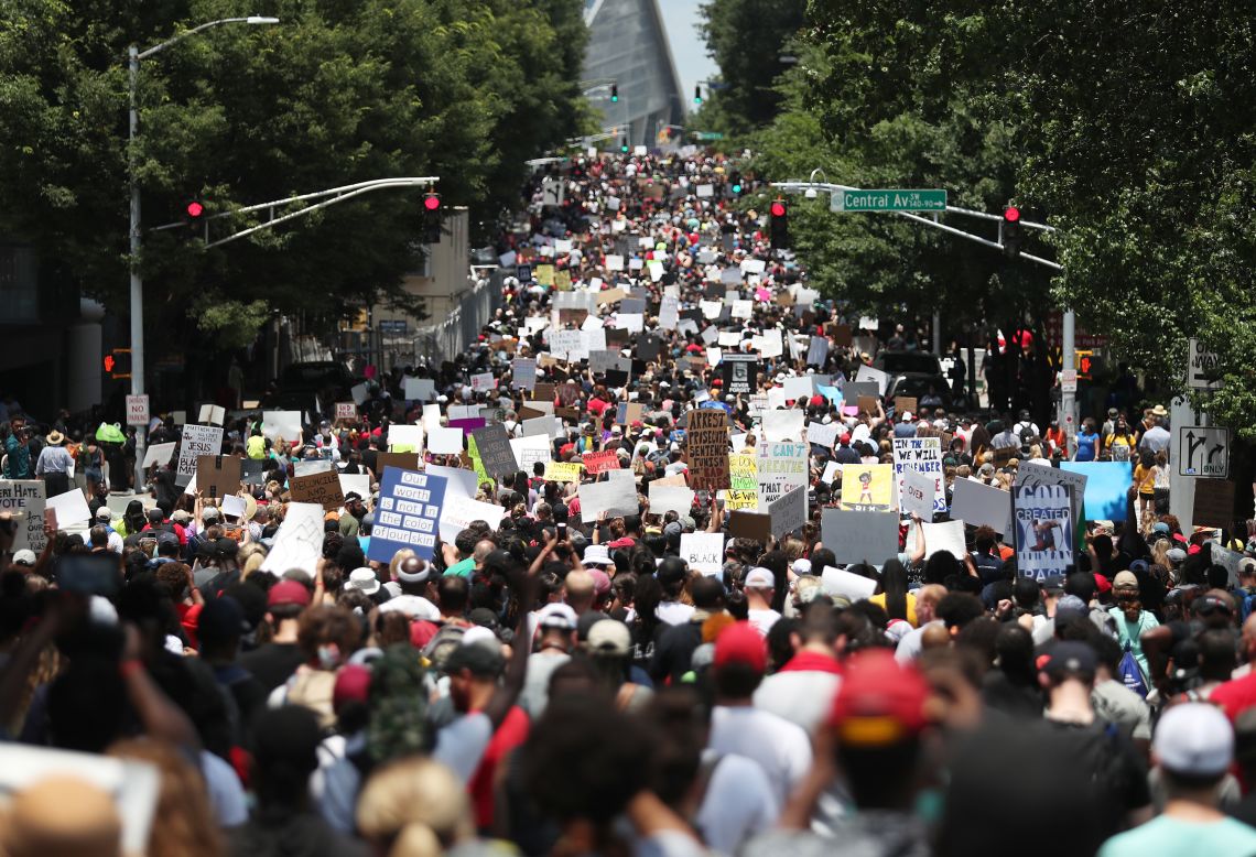 People march through the streets of Atlanta during a Juneteenth rally on Friday, June 19.