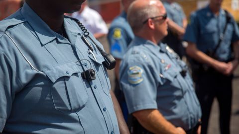 Officers in Ferguson, Missouri, are depicted wearing body cameras during a rally on August 30, 2014.