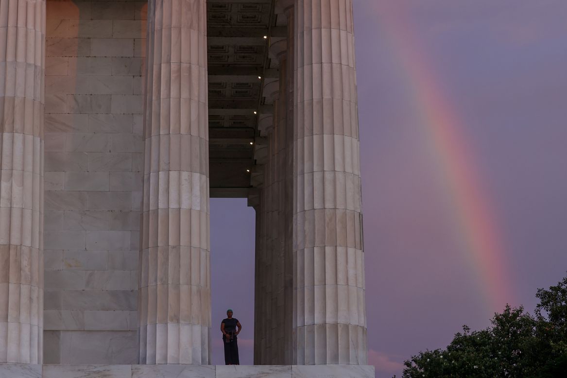 A rainbow appears behind the Lincoln Memorial as Lisa Fitzpatrick prepares to begin her day in Washington, DC, on Friday, June 19. Friday was the Juneteenth holiday that commemorates the end of slavery in the United States. <a href="http://www.cnn.com/2020/06/18/world/gallery/week-in-photos-0619/index.html" target="_blank">See last week in 37 photos</a>