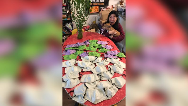 Kristina Wong of Los Angeles with the first batch of masks she sewed for fire fighters in New York.