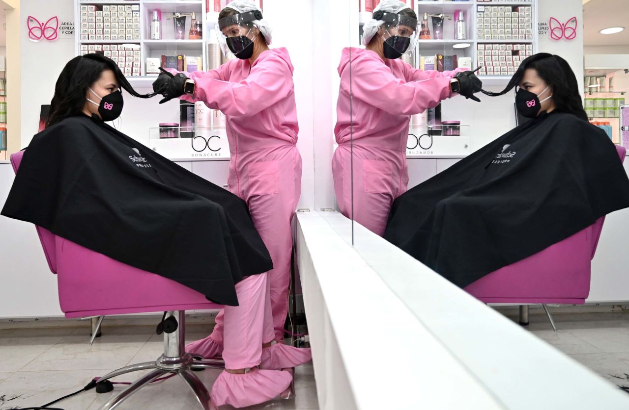A hairstylist wears a protective face shield in Bogota, Colombia, on June 23.