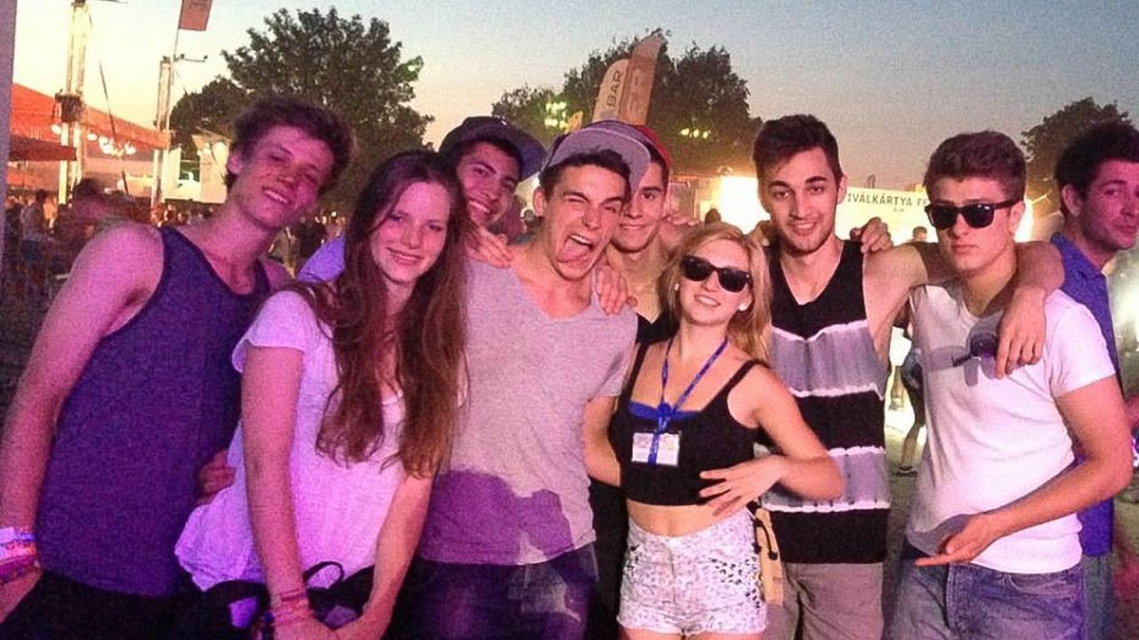 Szilágyi's son Peter, with his tongue out, enjoys the Balaton Sound festival with friends.