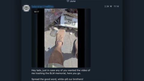 A man is seen "trashing" a Black Lives Matter memorial in a screengrab from a video shared on one of more than 200 White supremacist Telegram groups that have become much more active during protests across the United States. CNN has obscured identifying information in this image.