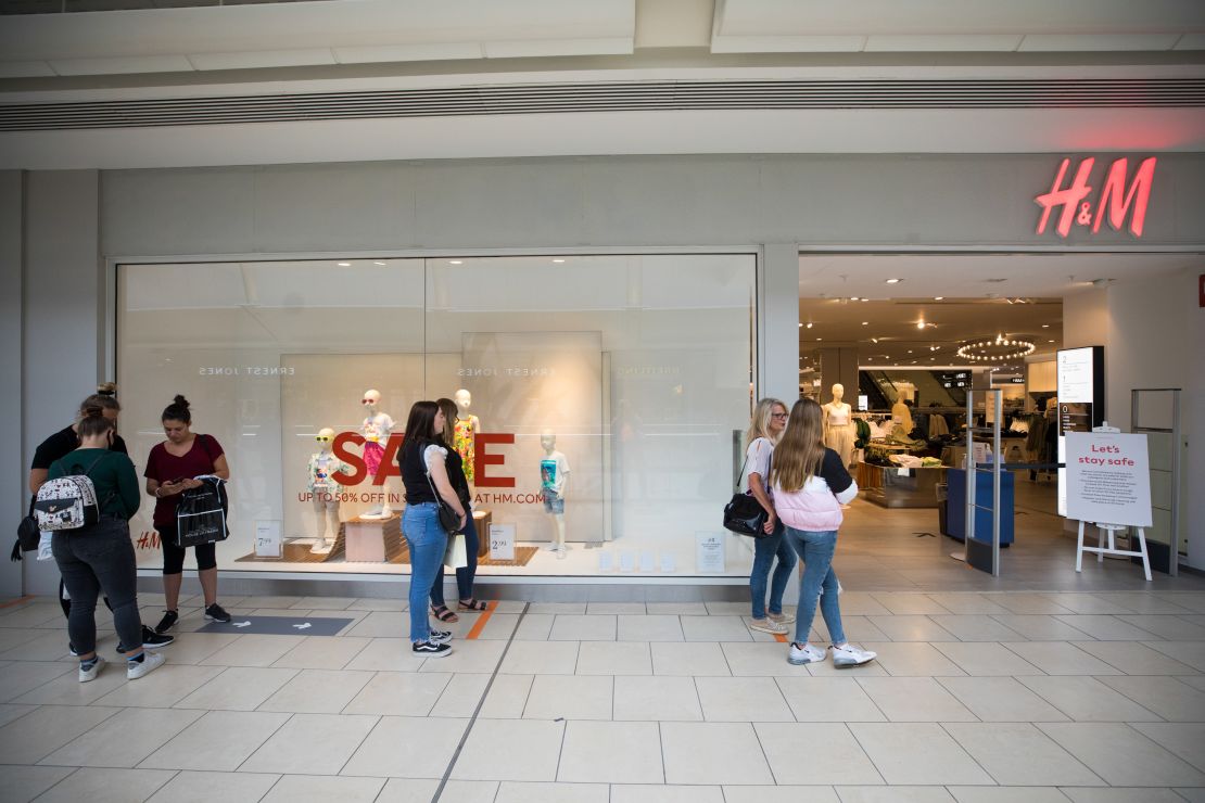 Shoppers queue at an H&M store at the Lakeside shopping centre, operated by Intu, in Thurrock, UK, on June 19.