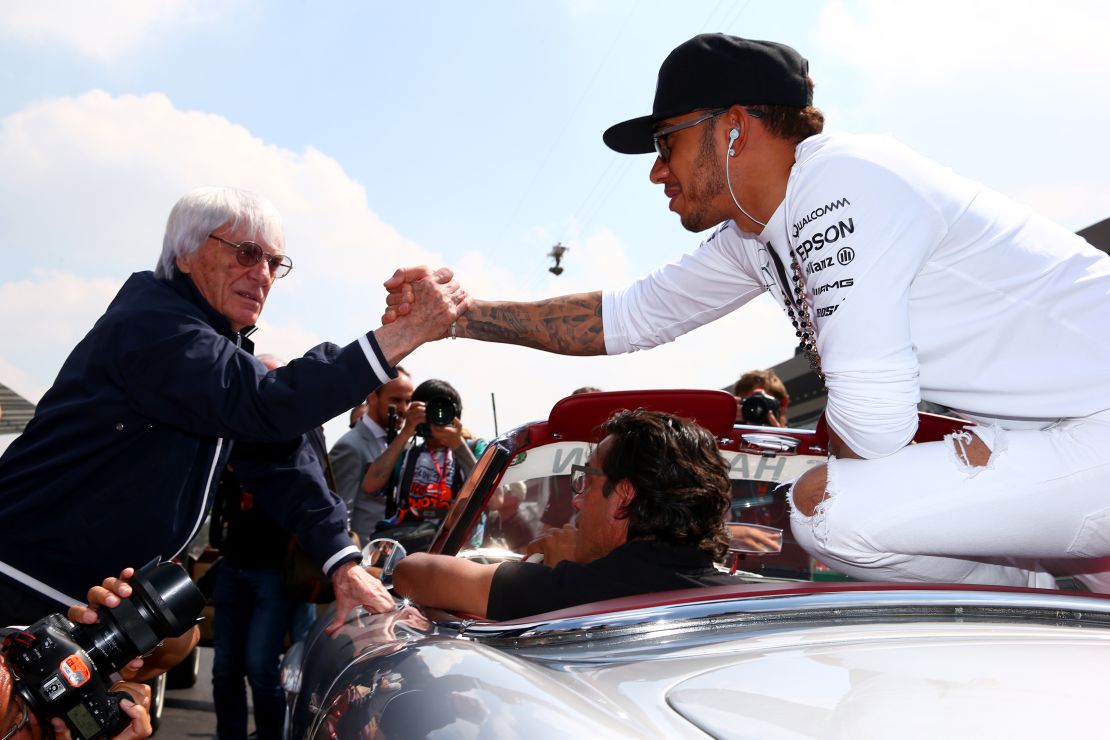 Bernie Ecclestone and Lewis Hamilton shake hands before the Mexico Grand Prix in 2015.