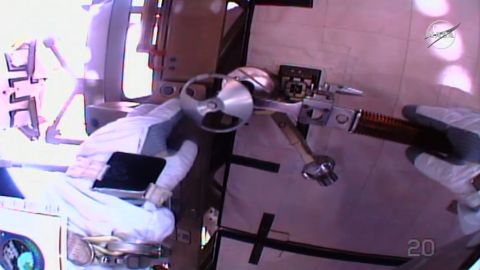 The astronauts are replacing large batteries during the spacewalk.