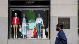 A pedestrian walks past a J.Crew store in Manhattan of New York, the United States, May 4, 2020. J. Crew Group, a U.S. apparel retailer which also operates the Madewell brand, has filed for bankruptcy protection, as the COVID-19 fallout continues to ripple through the nation. It has filed to begin Chapter 11 proceedings in the U.S. Bankruptcy Court for the Eastern District of Virginia, according to a statement by the company on Monday. The company said its lenders have agreed to convert approximately 1.65 billion U.S. dollars of its debt into equity. (Photo by Wang Ying/Xinhua/Getty Images)
