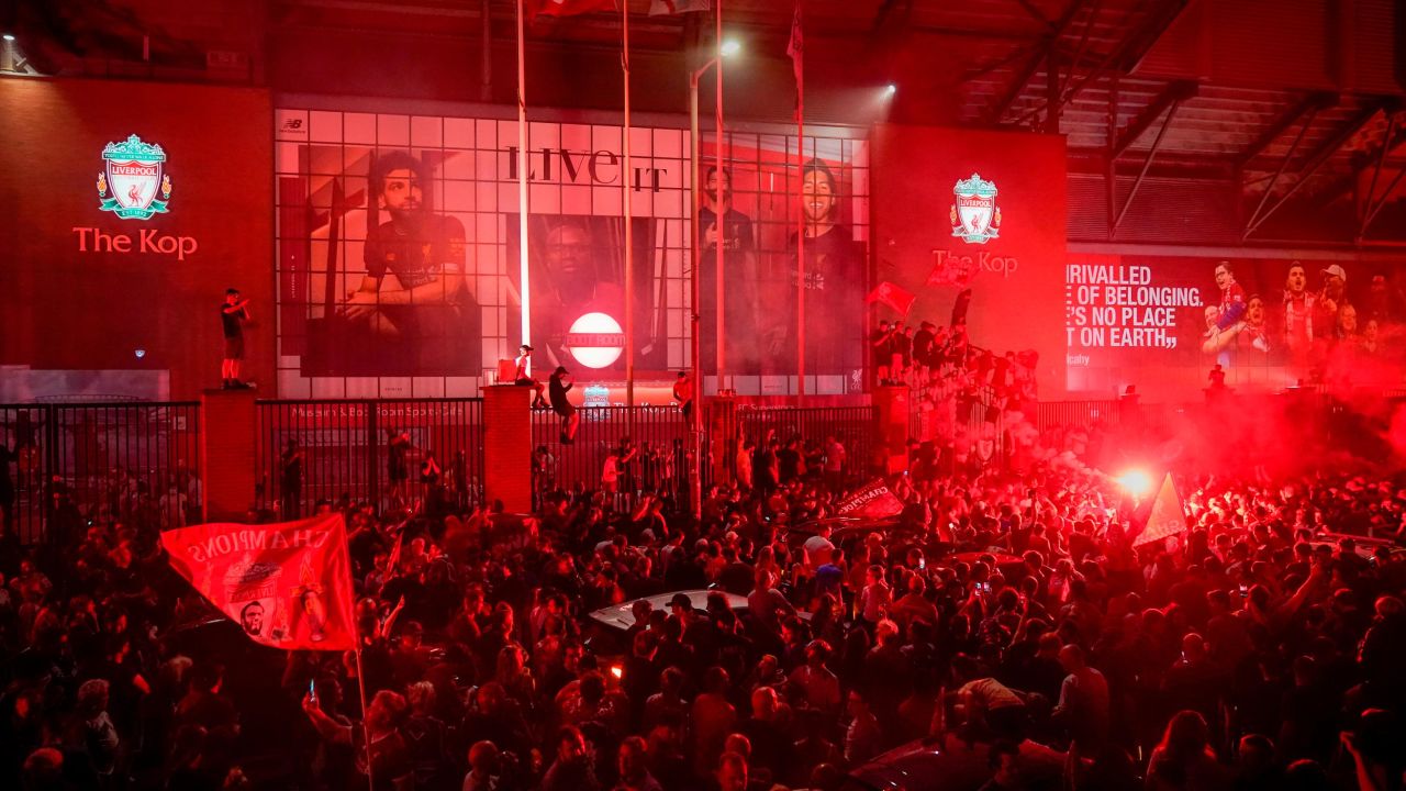 Liverpool fans celebrate at Anfield Stadium after wining the Premier League title.