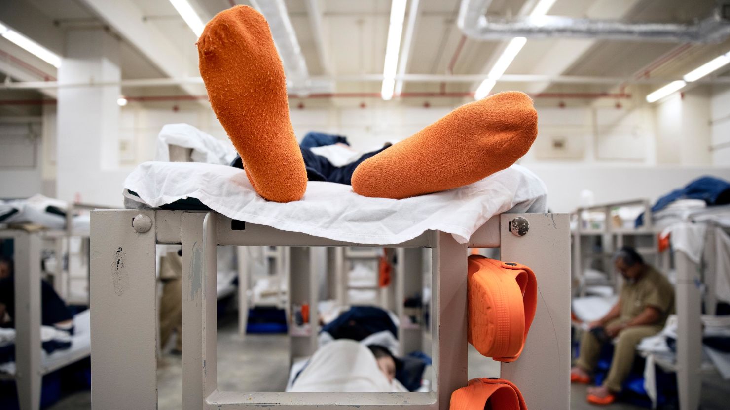 Detainees lay on their bunks in their pod at the Stewart Detention Center in Lumpkin, Georgia, on November 15, 2019. The center has also had confirmed coronavirus cases.