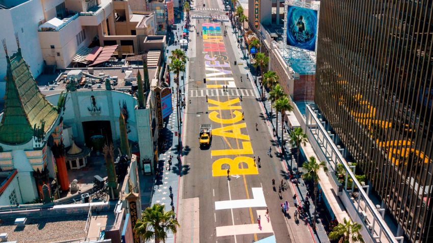 The words "All Black Lives Matter" are seen painted on Hollywood Blvd before the start a solidarity march between the LGBTQ+ and Black Lives Matter communities, June 14, 2020 in Hollywood California. - Protests against racism and police brutality continue around the country in the wake of the killing of George Floyd by Minneapolis police. (Photo by Robyn Beck / AFP) (Photo by ROBYN BECK/AFP via Getty Images)