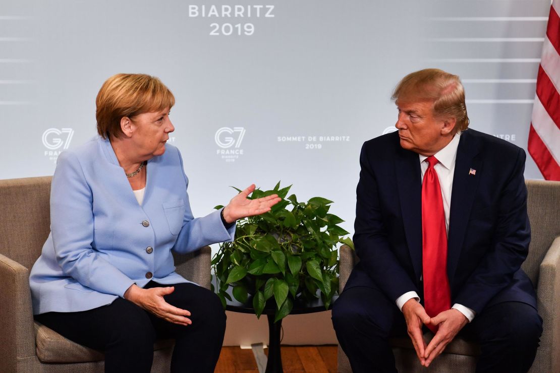 German Chancellor Angela Merkel and President Donald Trump speak during the G-7 summit in Biarritz, France, in August 2019.