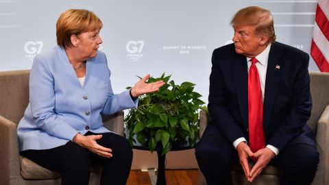 German Chancellor Angela Merkel and President Donald Trump speak during the G-7 summit in Biarritz, France, in August 2019.