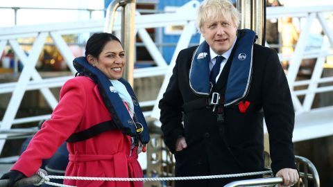 UK Home Secretary Priti Patel, left, with Prime Minister Boris Johnson on board a security vessel at the Port of Southampton on December 2, 2019.