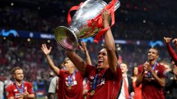 MADRID, SPAIN - JUNE 01: Trent Alexander-Arnold of Liverpool celebrates with the Champions League Trophy after winning the UEFA Champions League Final between Tottenham Hotspur and Liverpool at Estadio Wanda Metropolitano on June 01, 2019 in Madrid, Spain. (Photo by Matthias Hangst/Getty Images)