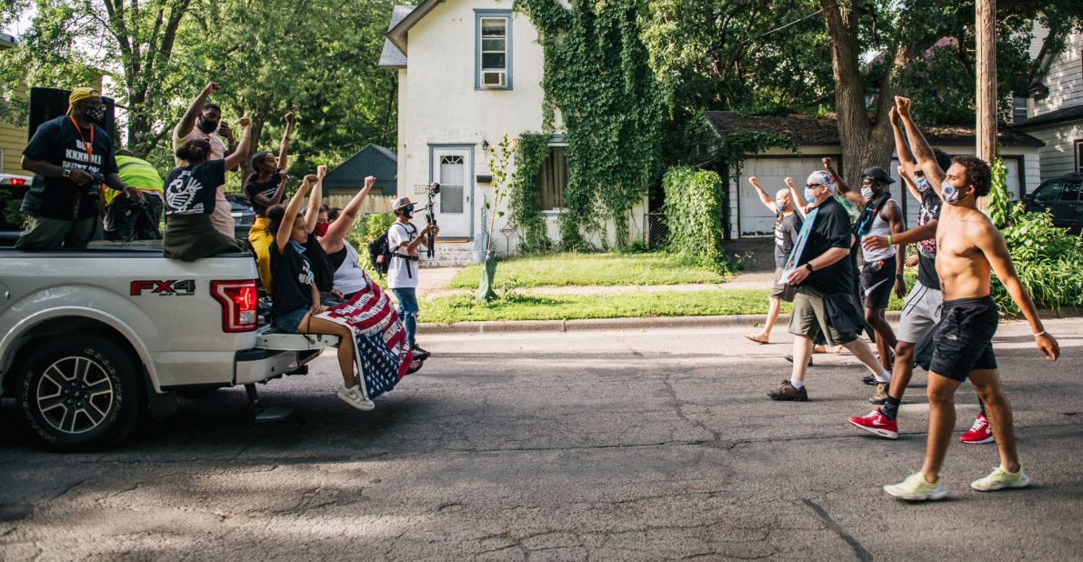 Protesters march in the street during a demonstration in Minneapolis on June 25.