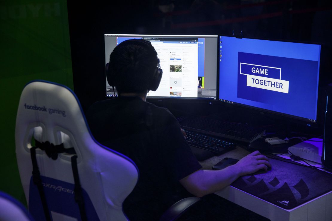 An attendee plays a game at the Facebook Inc. Gaming booth during the E3 Electronic Entertainment Expo in Los Angeles, California, U.S., on Wednesday, June 12, 2019. For three days, leading-edge companies, groundbreaking new technologies and never-before-seen products are showcased at E3. Photographer: Patrick T. Fallon/Bloomberg via Getty Images