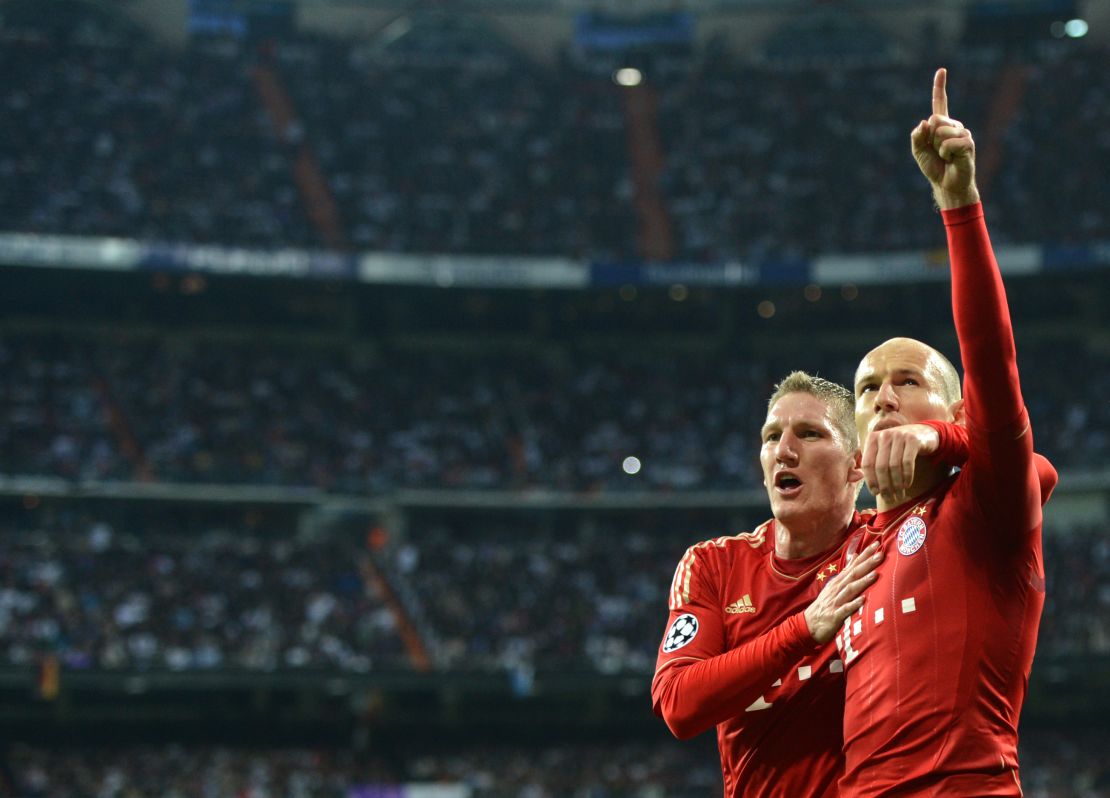 Arjen Robben (right) celebrates scoring a penalty against former club Real Madrid in 2012. 