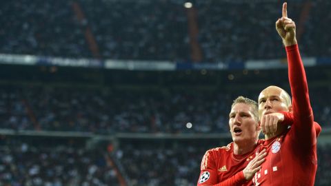 Arjen Robben (right) celebrates scoring a penalty against former club Real Madrid in 2012.