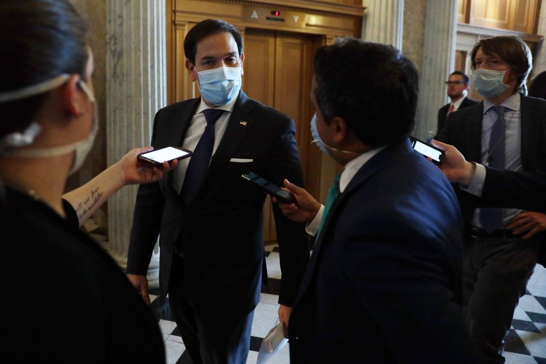 "Everyone should just wear a damn mask," says Republican Senator Marco Rubio. He followed his own advice as he arrived for a vote in Washington, DC, on June 14.