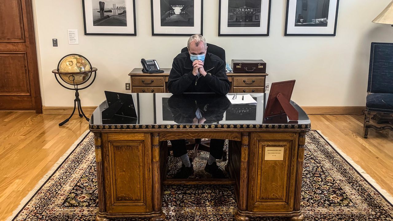 New Jersey Gov. Phil Murphy tweeted this picture of him taking a moment of silence for George Floyd on June 4 as he sits behind a desk that once belonged to Woodrow Wilson.