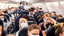 Passengers are welcomed on a Corendon plane departing from Amsterdam's Schiphol airport to Bulgaria's Burgas airport, on June 26, 2020, on the first holiday flight by the travel company since the novel coronavirus in March. (Photo by Jeffrey Groeneweg/ANP/AFP/Getty Images)