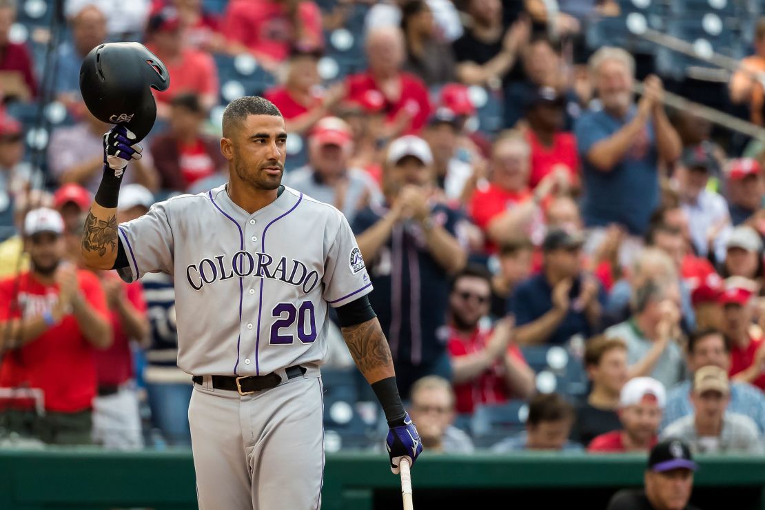 Ian Desmond #20 of the Colorado Rockies salutes the fans during a game.