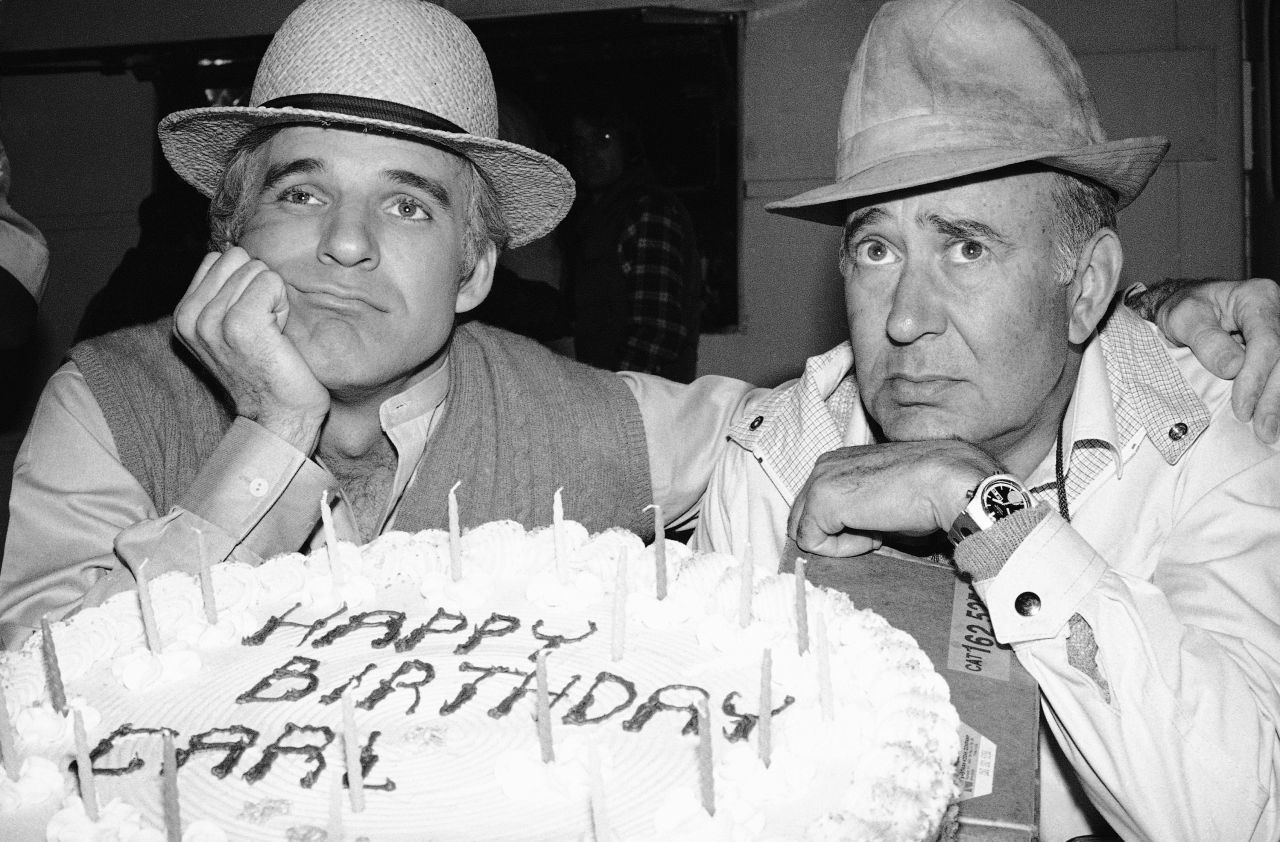 Comedian Steve Martin poses by Reiner's birthday cake on March 20, 1979. Reiner was born in the Bronx, New York, in 1922.