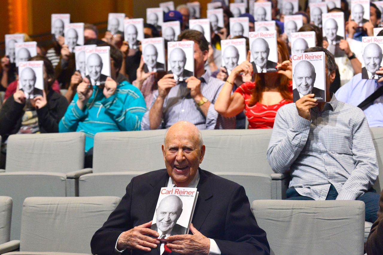 Reiner holds a copy of his book, "I Remember Me," in Beverly Hills, California, in 2013. In the book, Reiner shares memories about his life and show business.