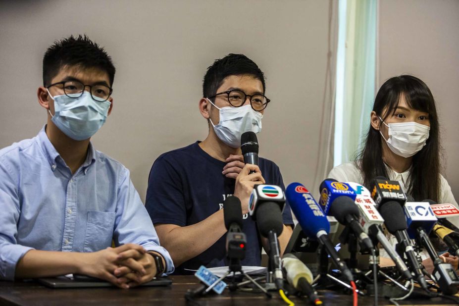 From left, Joshua Wong, Nathan Law and Agnes Chow — members of the pro-democracy political group Demosisto — hold a news conference on May 30. A month later, Demosisto and several other political and activist groups formally disbanded, fearing they could be targeted under the new law.