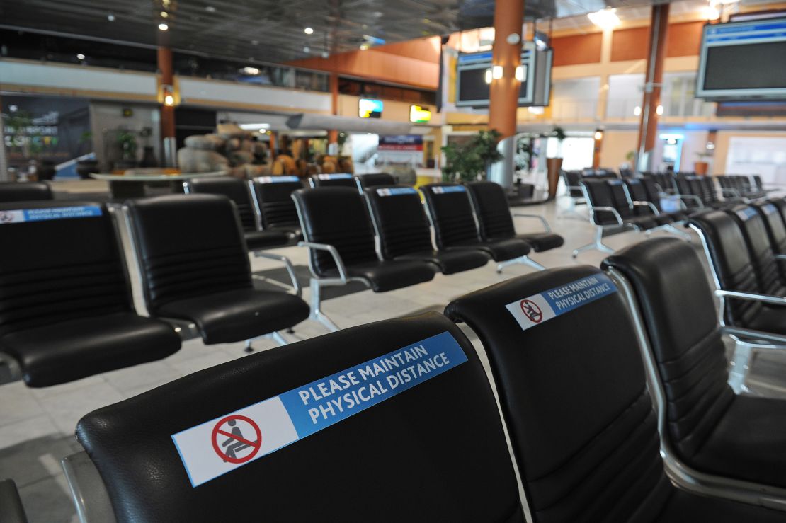 Empty rows of seats line the terminal at Cape Town International Airport in early June. Domestic flights began June 15, but demand for travel is expected to stay low.