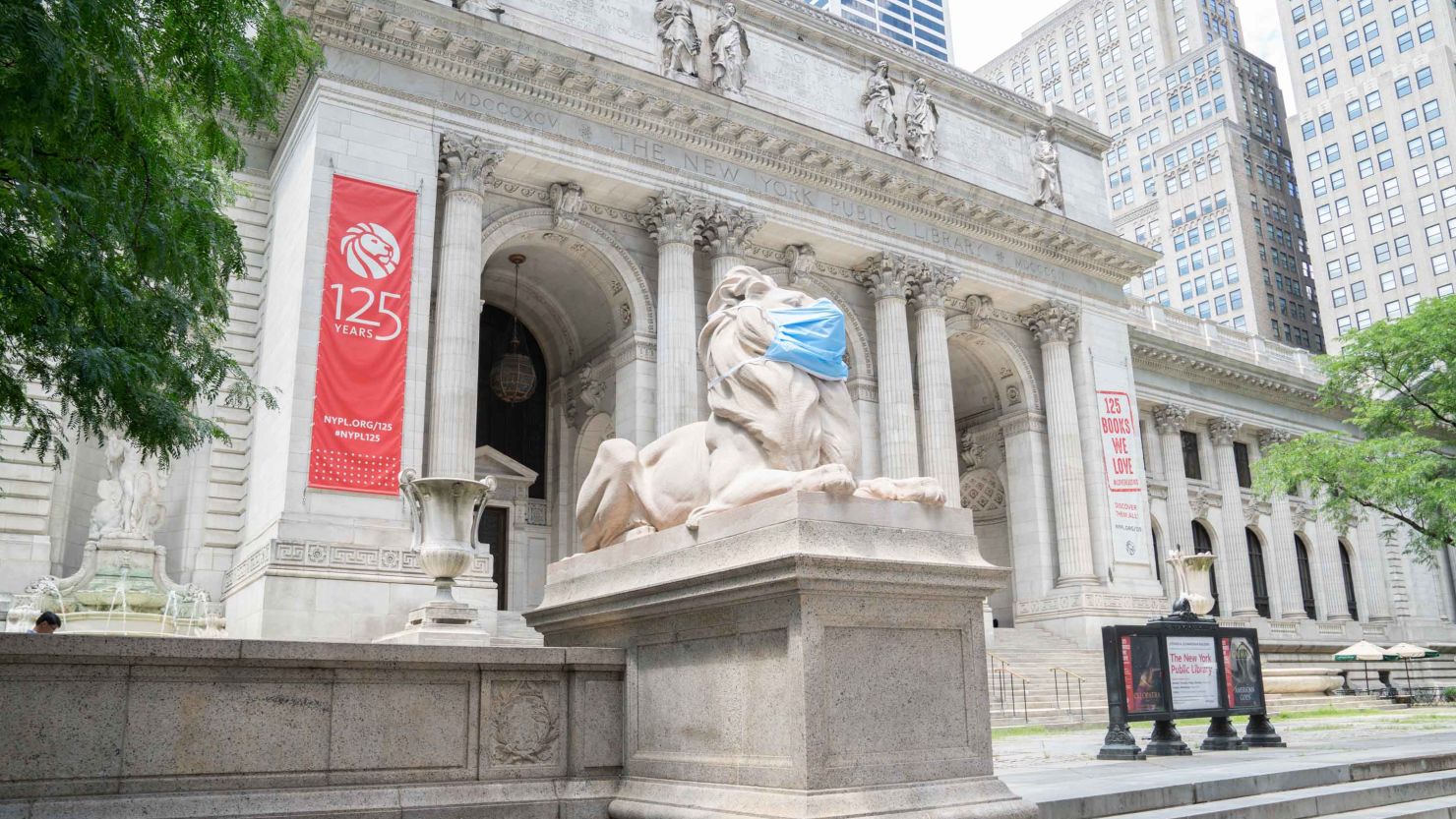 The twin lion sculptures that sit outside of the New York Public Library's Fifth Avenue and 42nd Street branch are now sporting masks to encourage New Yorkers to continue to follow safety measures. 