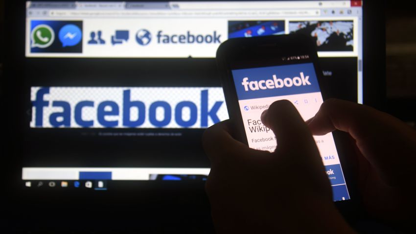A cellphone and a computer screen display the logo of the social networking site Facebook on March 22, 2018, in Asuncion.
Zuckerberg on March 22 failed to quell outrage over the hijacking of personal data from millions of people, as critics demanded the social media giant go much further to protect privacy. / AFP PHOTO / NORBERTO DUARTE        (Photo credit should read NORBERTO DUARTE/AFP via Getty Images)