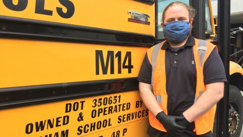 Ward in front of the school bus he drove while students were still going to school before the Covid-19 pandemic. 