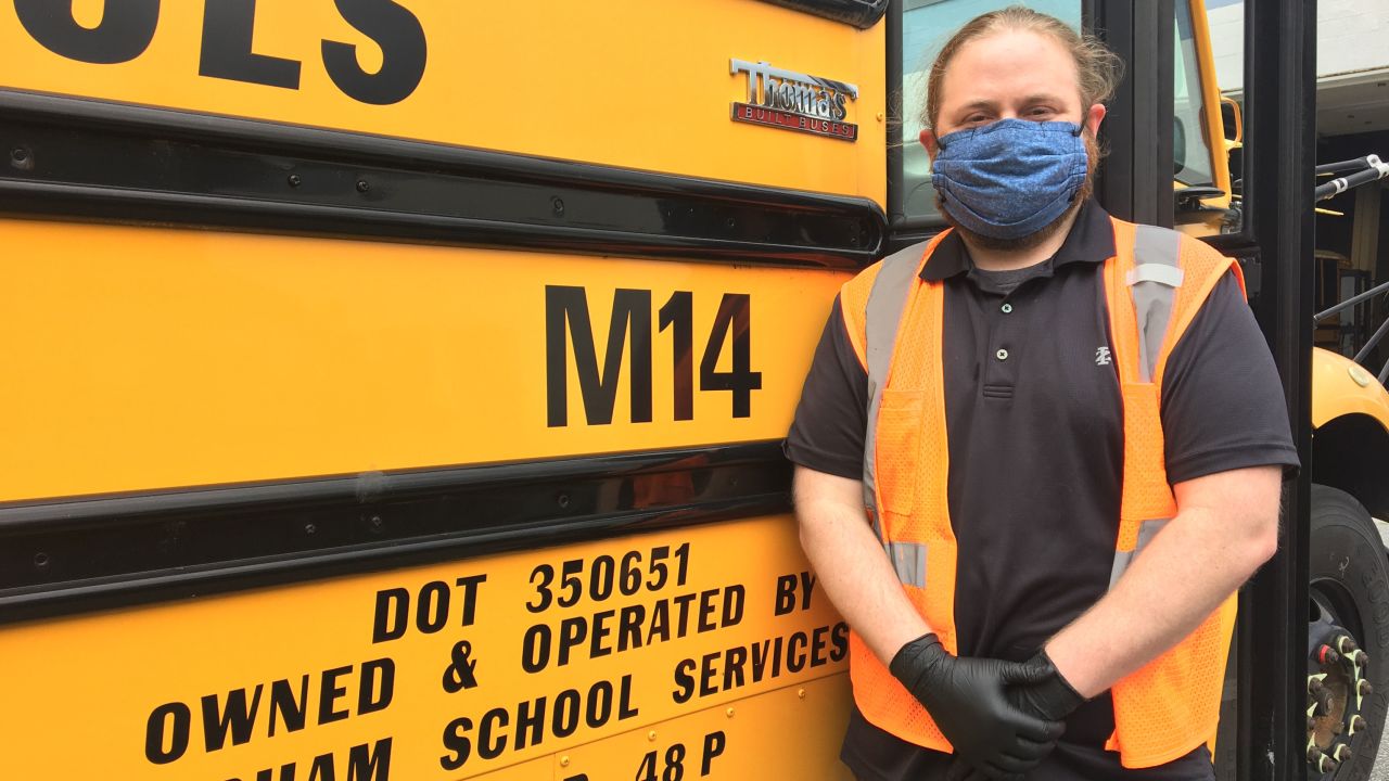 Ward in front of the school bus he drove while students were still going to school before the Covid-19 pandemic.