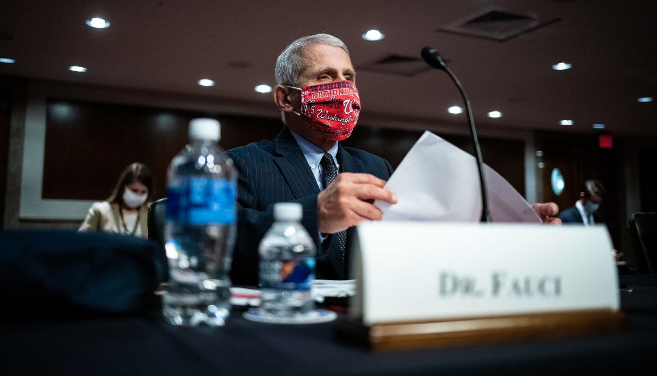 Dr. Anthony Fauci, director of the National Institute of Allergy and Infectious Diseases, wears a Washington Nationals mask June 30 as he arrives <a href="index.php?page=&url=https%3A%2F%2Fwww.cnn.com%2F2020%2F06%2F30%2Fpolitics%2Ffauci-redford-testimony-senate-coronavirus%2Findex.html" target="_blank">to testify at a Senate committee hearing</a> about the coronavirus pandemic. Fauci issued a stark warning to lawmakers, telling them he wouldn't be surprised if the United States sees new cases of coronavirus rising to a level of 100,000 a day.