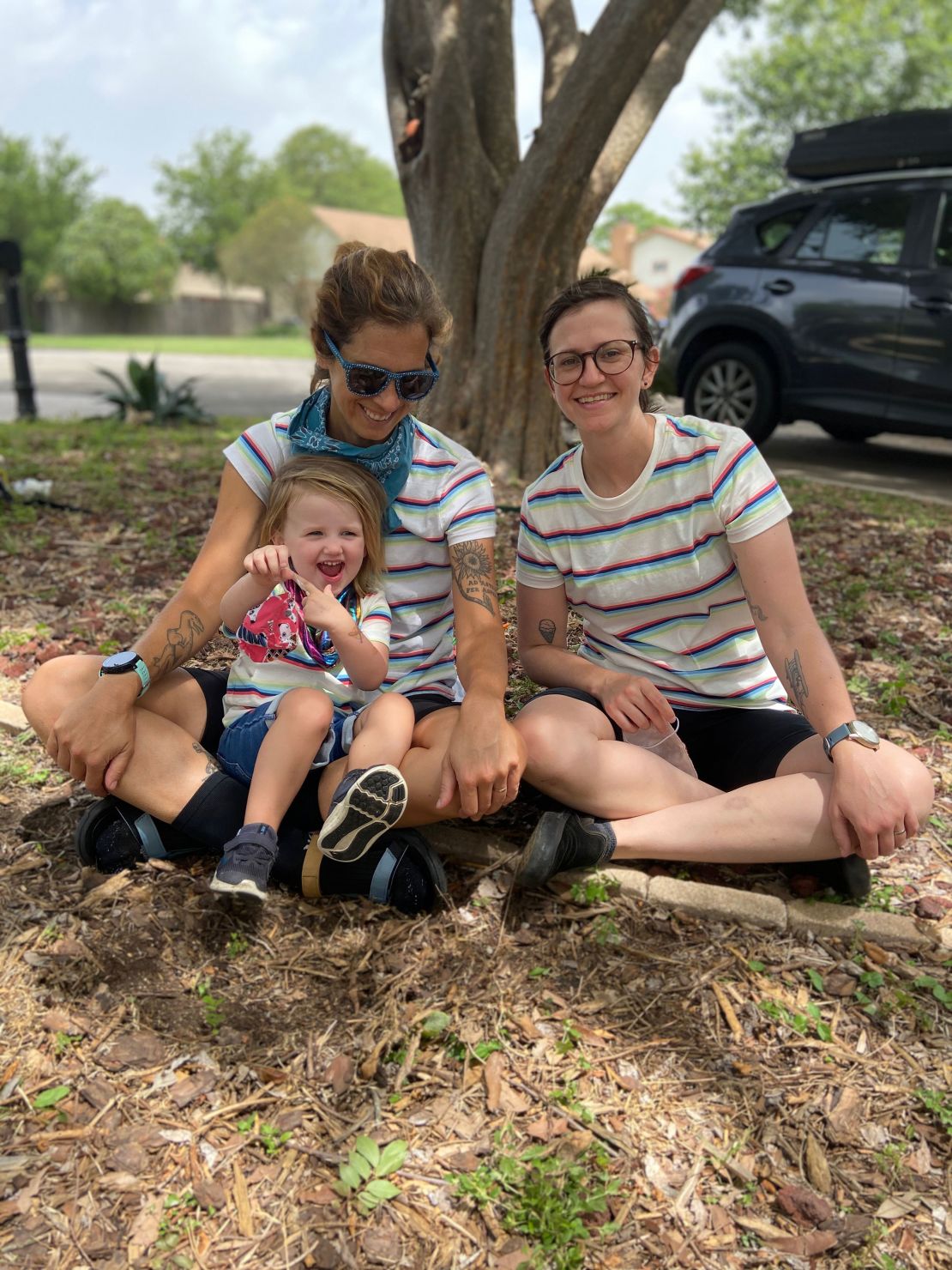 Caitlin Giddings (far left) of Austin, Texas, is shown here with her family. With the rise of Covid-19 cases, she's considering whether to remove their 2-year-old from day care — for the second time.