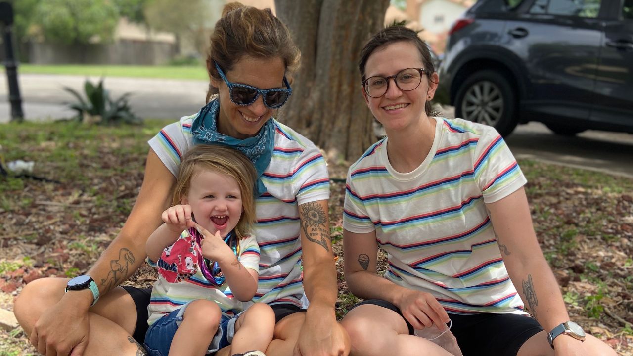 Caitlin Giddings (far left) of Austin, Texas, is shown here with her family. With the rise of Covid-19 cases, she's considering whether to remove their 2-year-old from day care — for the second time.