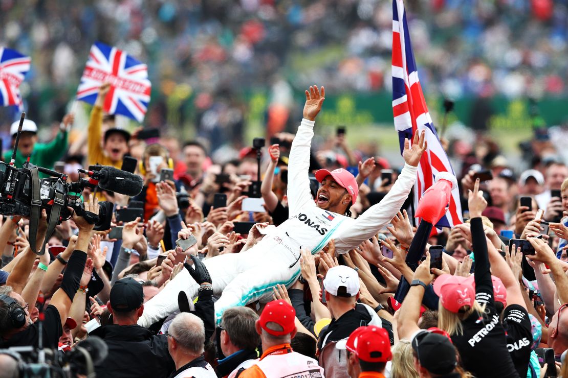 Hamilton celebrates after winning the British GP on July 14, 2019 in Northampton, England.