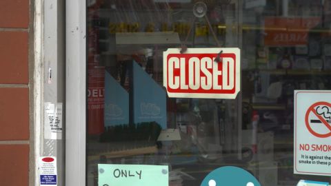 A closed sign in the window of a business in the city, which faced a fresh surge in cases as the UK reopened.
