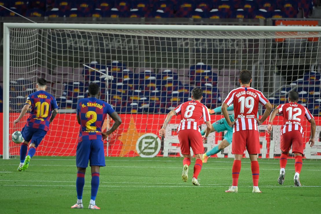 Barcelona's Lionel Messi scores a penalty to reach 700 career goals.