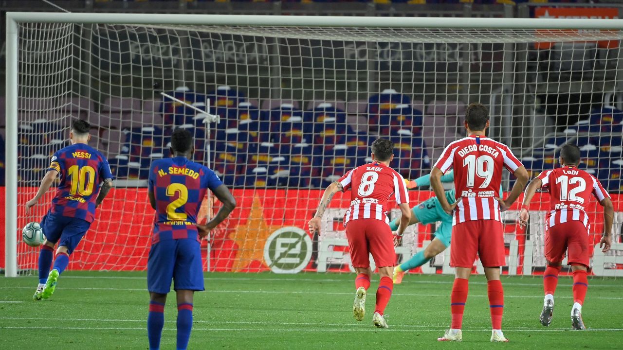 Barcelona's Lionel Messi scores a penalty to reach 700 career goals.