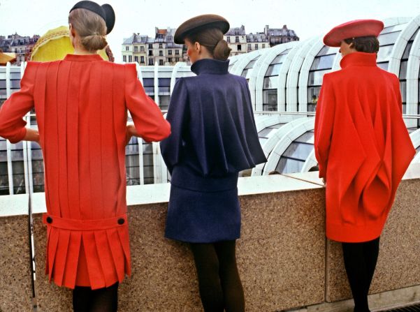 Jackets and suits often featured exaggerated silhouettes. Here, three women model for Pierre Cardin's 1980 Fall-Winter couture collection in Paris.